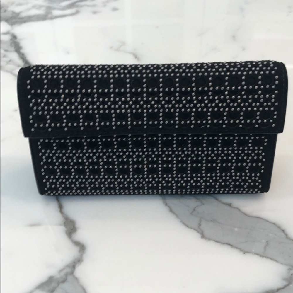 Alaia black studded clutch bag